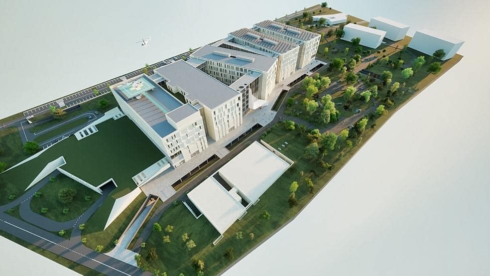 Randare aeriană a unui complex spitalicesc cu clădiri etajate, heliport pe acoperișul unei clădiri, parcări și spații verzi